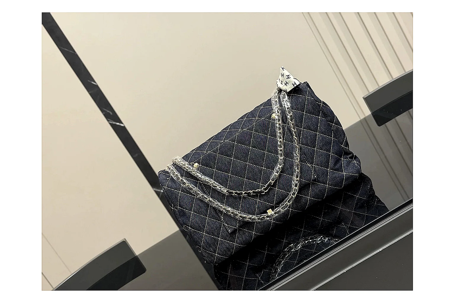 Chanel Quilted Flap Bag Black Denim comparison photo showing black denim-look quilted flap body, shoulder-bag shape, chain strap, and polished hardware thumbnail 5