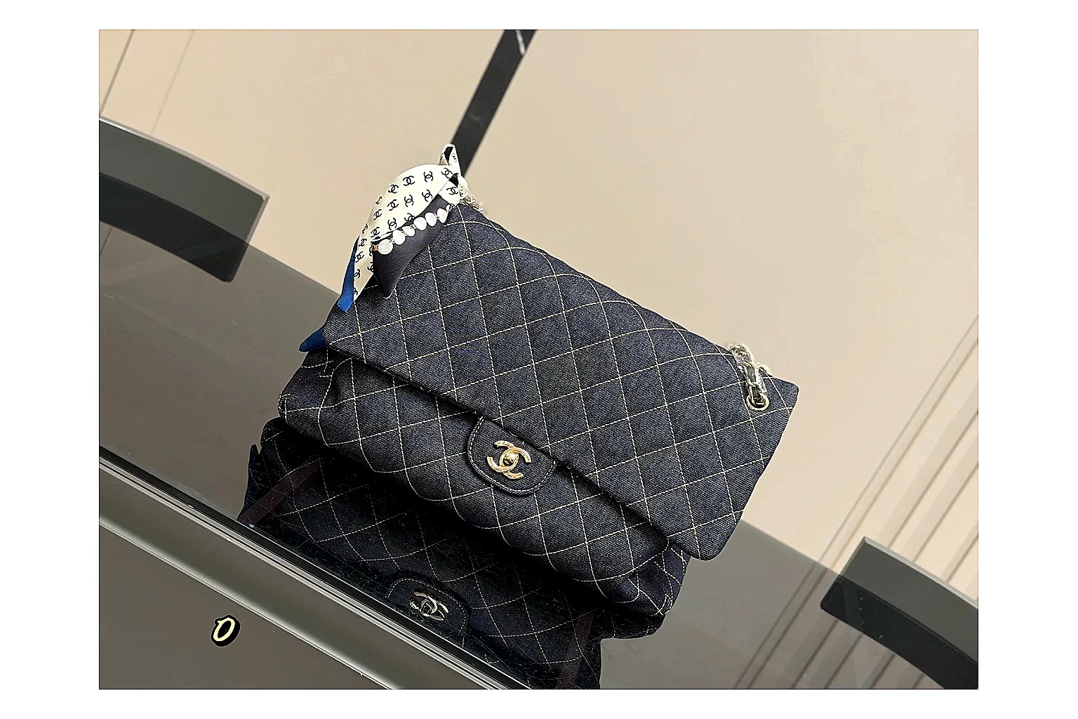 Chanel Quilted Flap Bag Black Denim comparison photo showing black denim-look quilted flap body, shoulder-bag shape, chain strap, and polished hardware thumbnail 6