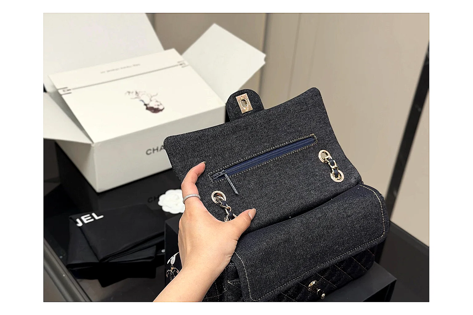 Chanel Quilted Flap Bag Black Navy comparison photo showing black navy quilted leather body, flap structure, chain strap, and polished luxury hardware