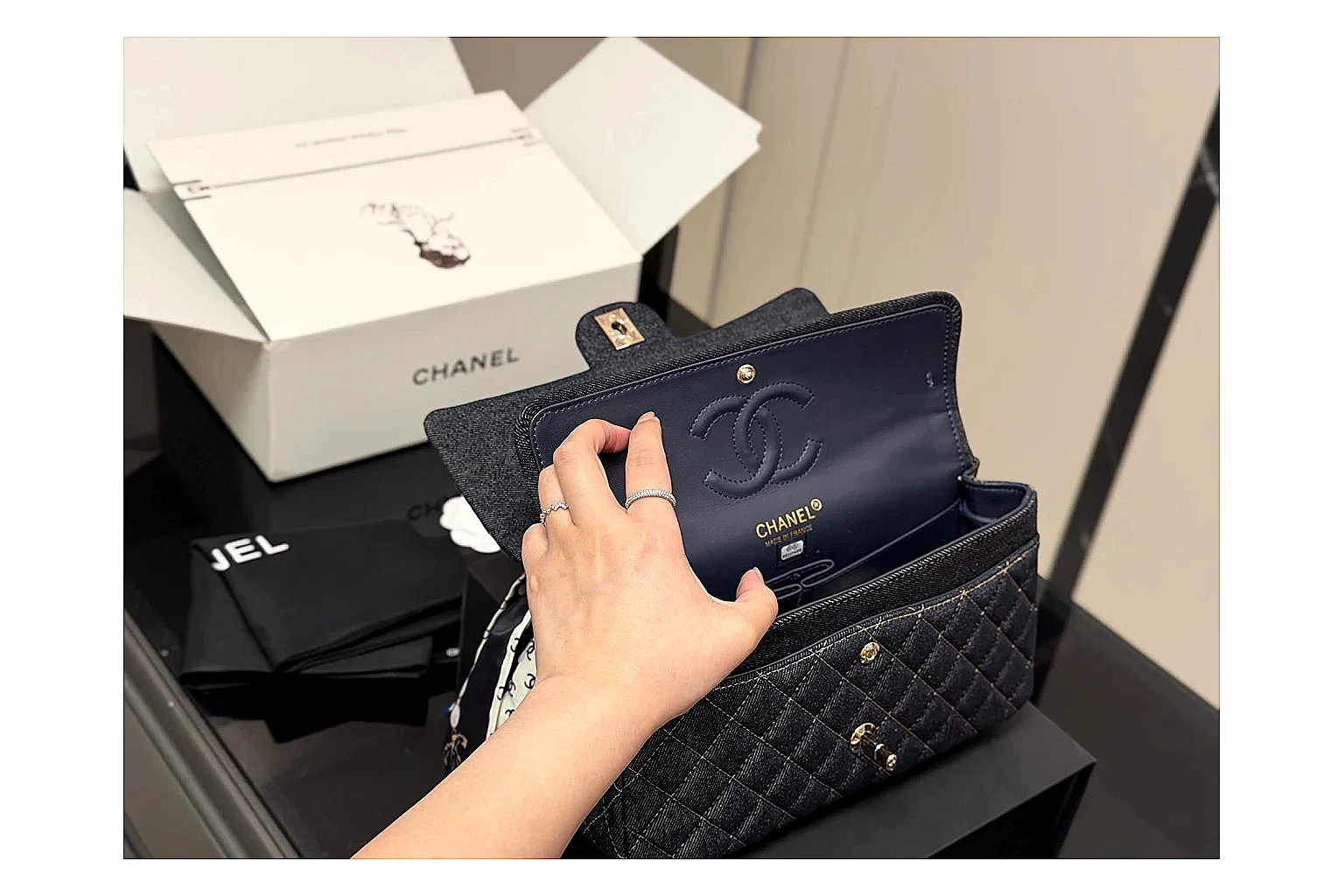 Chanel Quilted Flap Bag Black Navy comparison photo showing black navy quilted leather body, flap structure, chain strap, and polished luxury hardware thumbnail 4