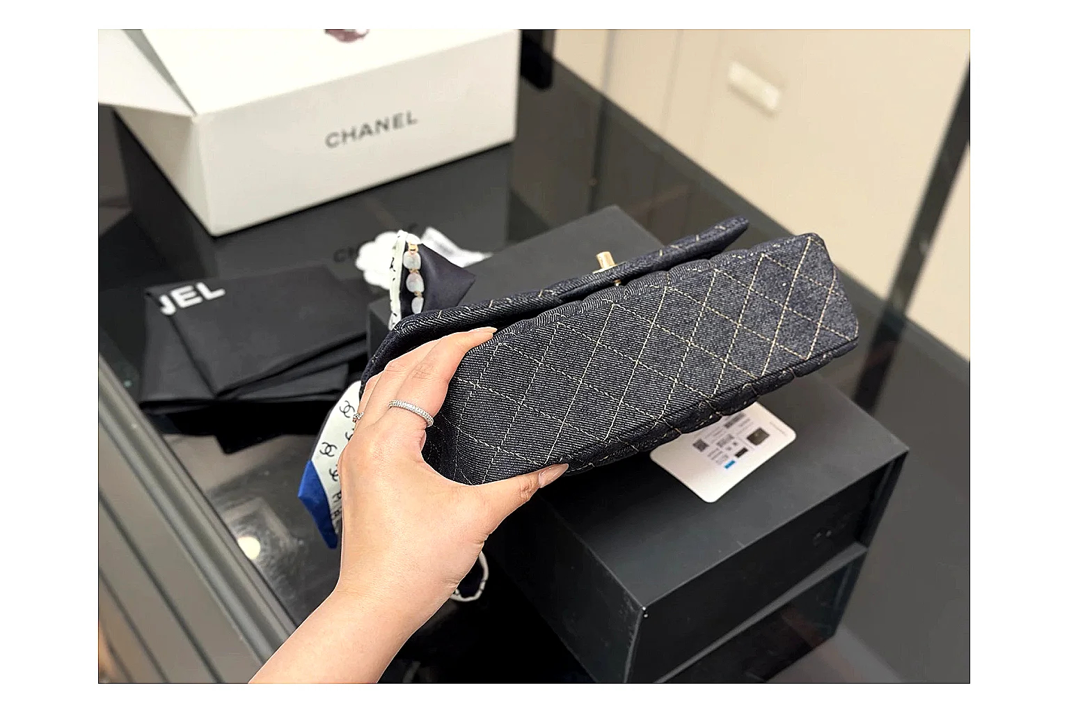 Chanel Quilted Flap Bag Black Navy comparison photo showing black navy quilted leather body, flap structure, chain strap, and polished luxury hardware thumbnail 5