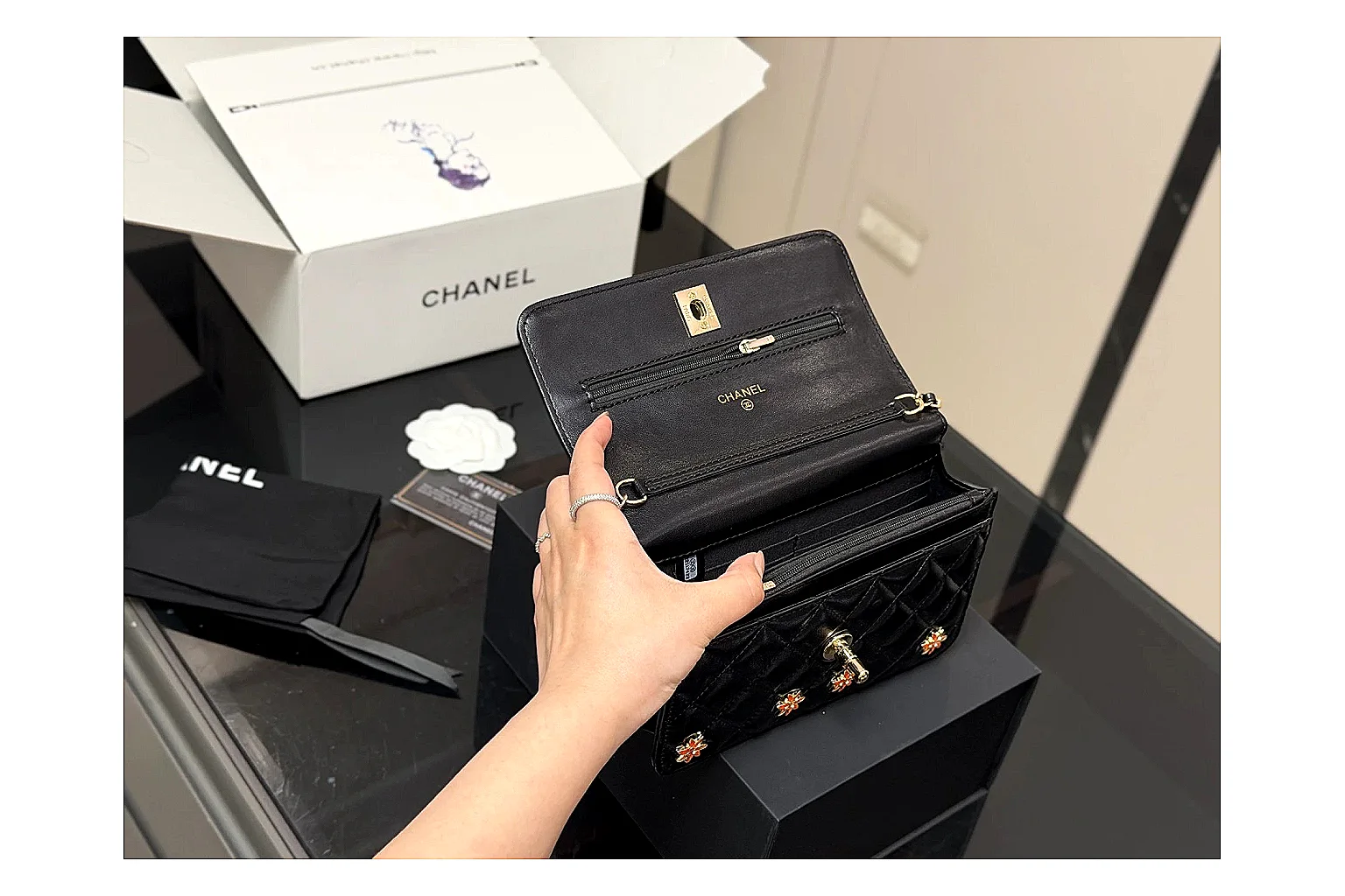 Chanel Quilted Wallet Bag Black Floral comparison photo showing black quilted wallet-bag body, floral detail, compact flap shape, and polished chain hardware thumbnail 2