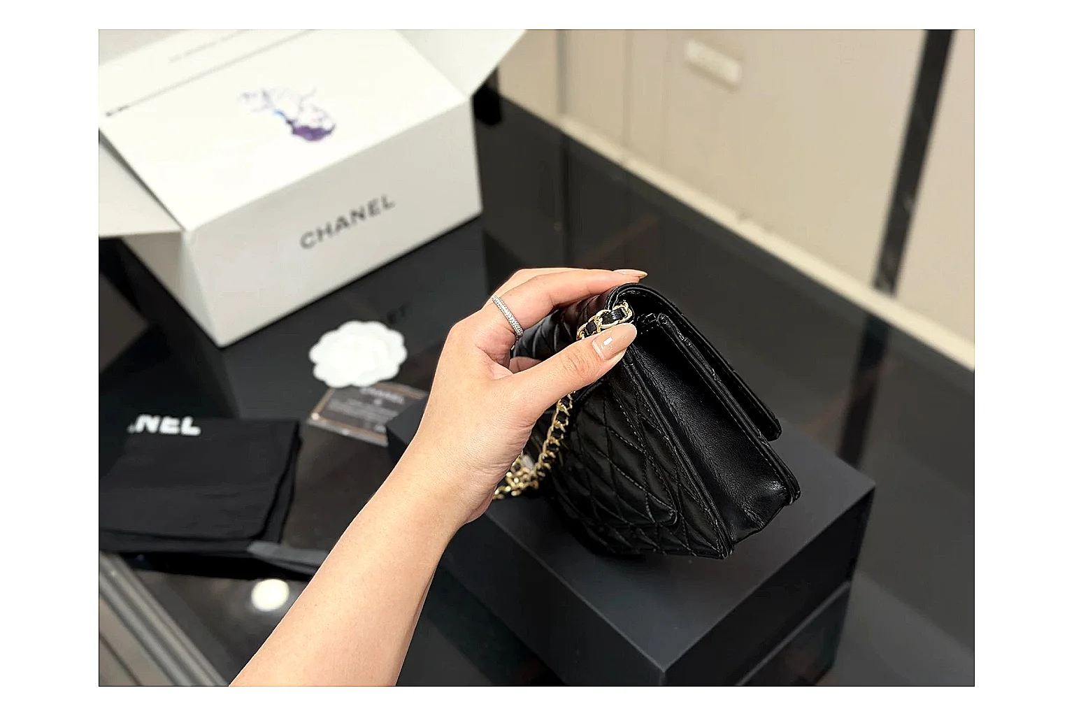 Chanel Quilted Wallet Bag Black Floral comparison photo showing black quilted wallet-bag body, floral detail, compact flap shape, and polished chain hardware thumbnail 3