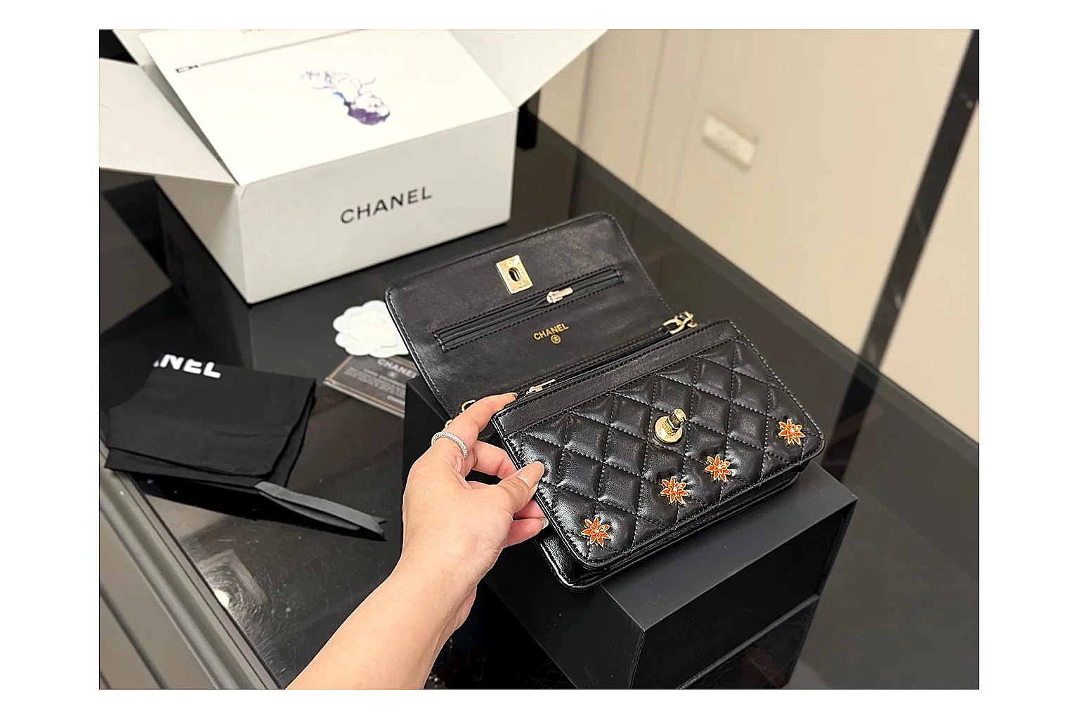 Chanel Quilted Wallet Bag Black Floral comparison photo showing black quilted wallet-bag body, floral detail, compact flap shape, and polished chain hardware thumbnail 4