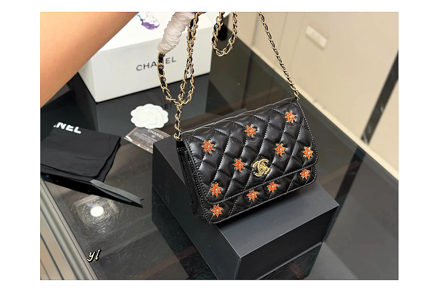 Chanel Quilted Wallet Bag Black Floral comparison photo showing black quilted wallet-bag body, floral detail, compact flap shape, and polished chain hardware thumbnail 6