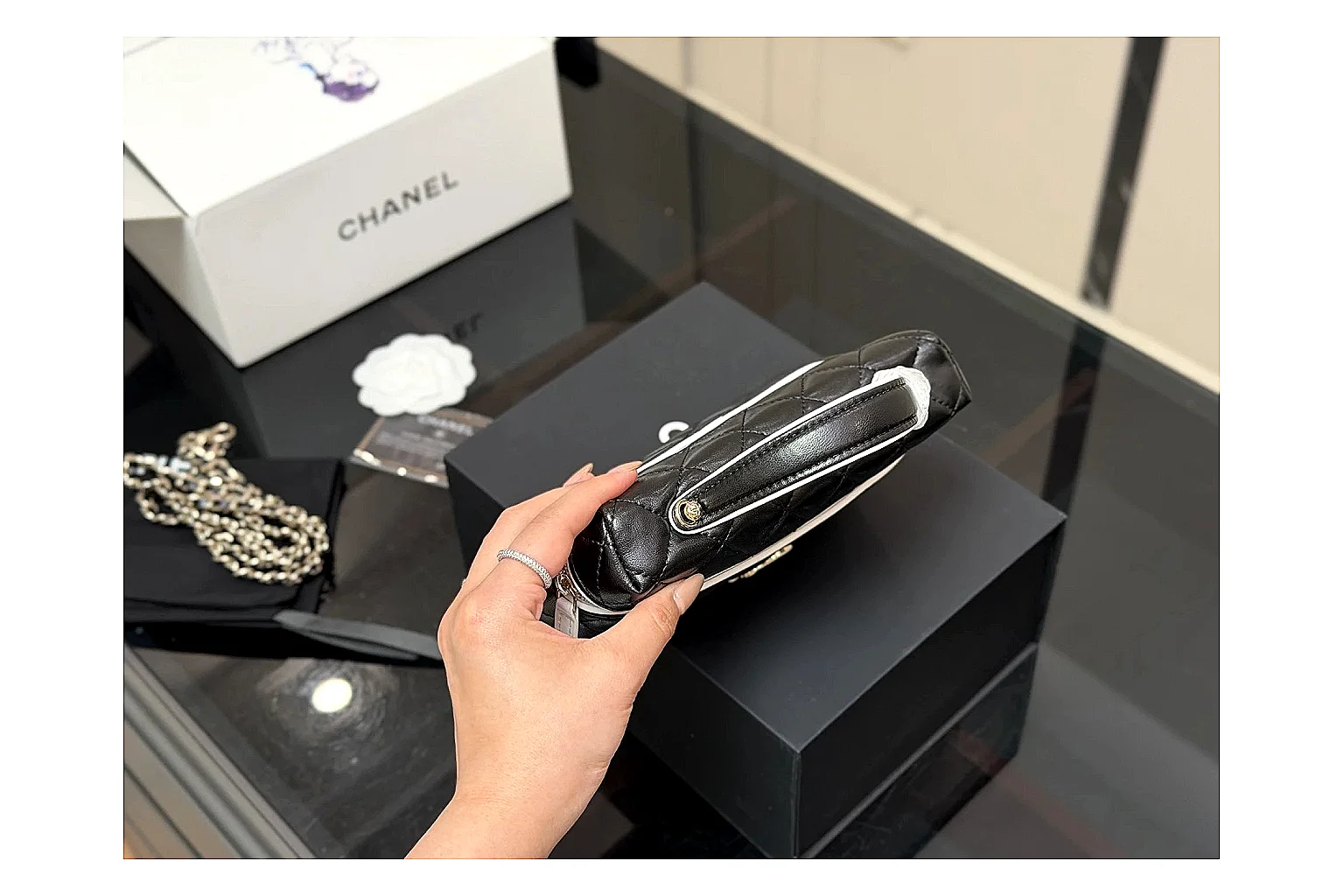 Chanel Wallet On Chain Black comparison photo showing black quilted leather wallet body, chain strap, flap closure, and compact shoulder-bag profile