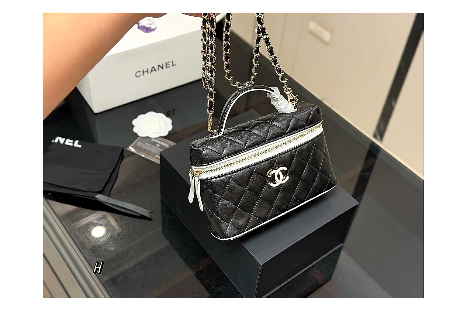 Chanel Wallet On Chain Black comparison photo showing black quilted leather wallet body, chain strap, flap closure, and compact shoulder-bag profile thumbnail 6