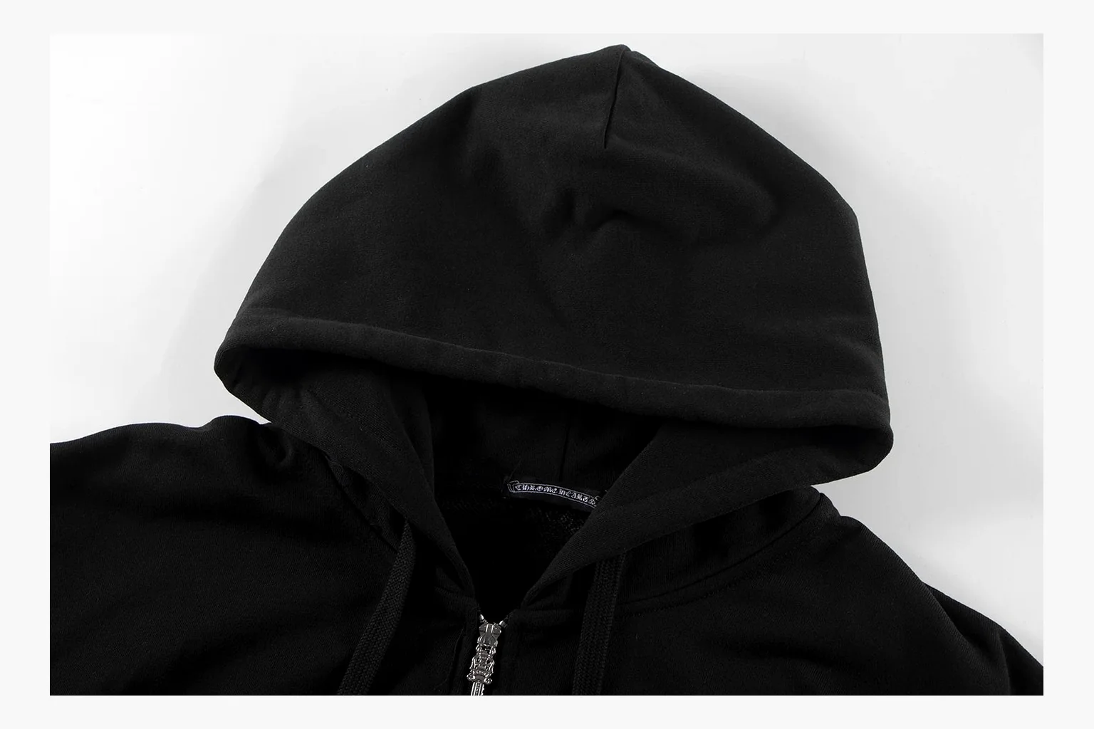 Chrome Hearts Cross Zip Hoodie Black comparison photo showing black cotton fleece zip hoodie, large back cross graphic, silver zipper pull, hood drawcords, and front pocket structure