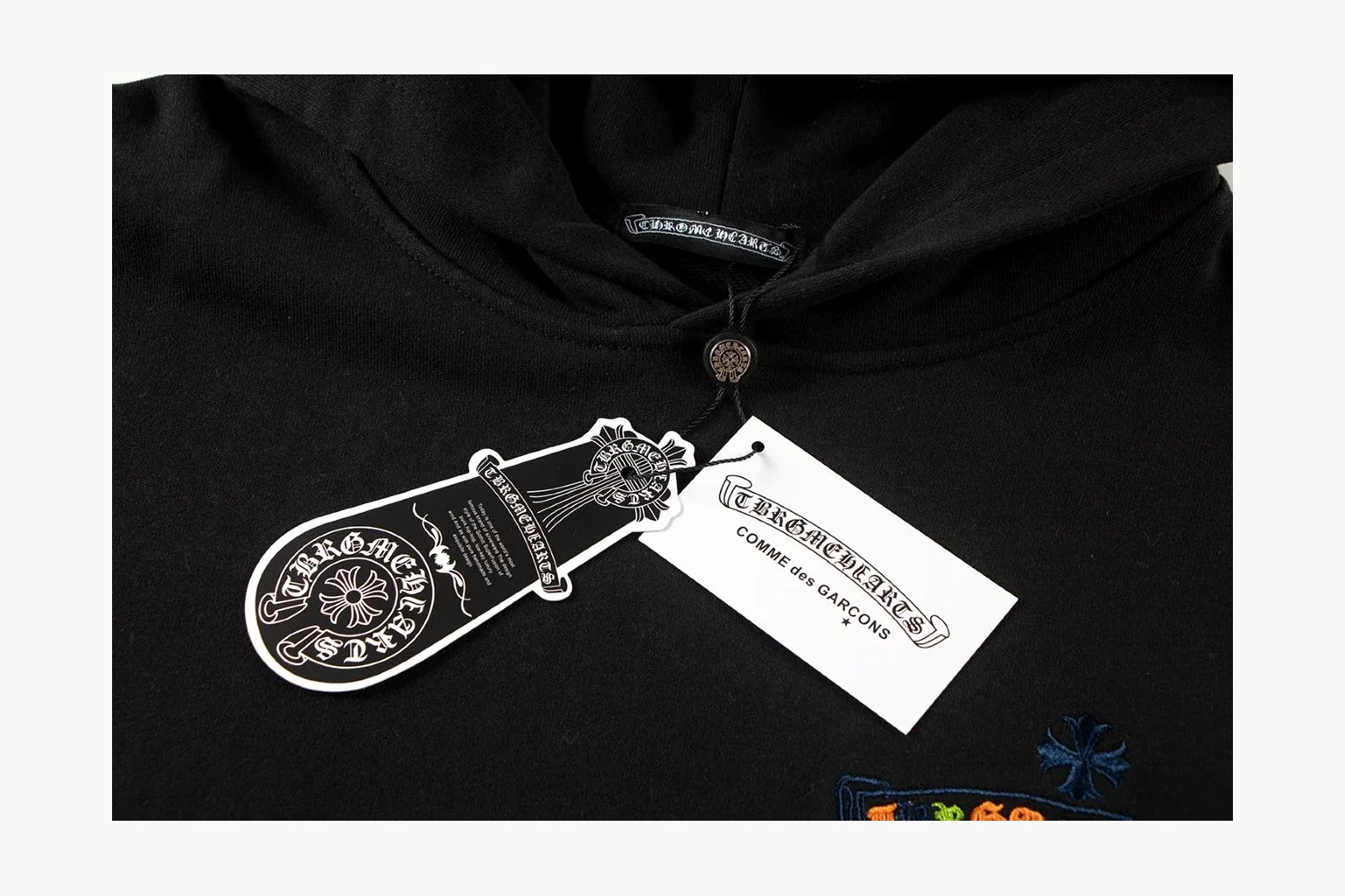 Chrome Hearts Rainbow Logo Hoodie Black comparison photo showing black cotton fleece pullover body, colorful back logo, hood detail, sleeve print, kangaroo pocket, and ribbed trim thumbnail 3