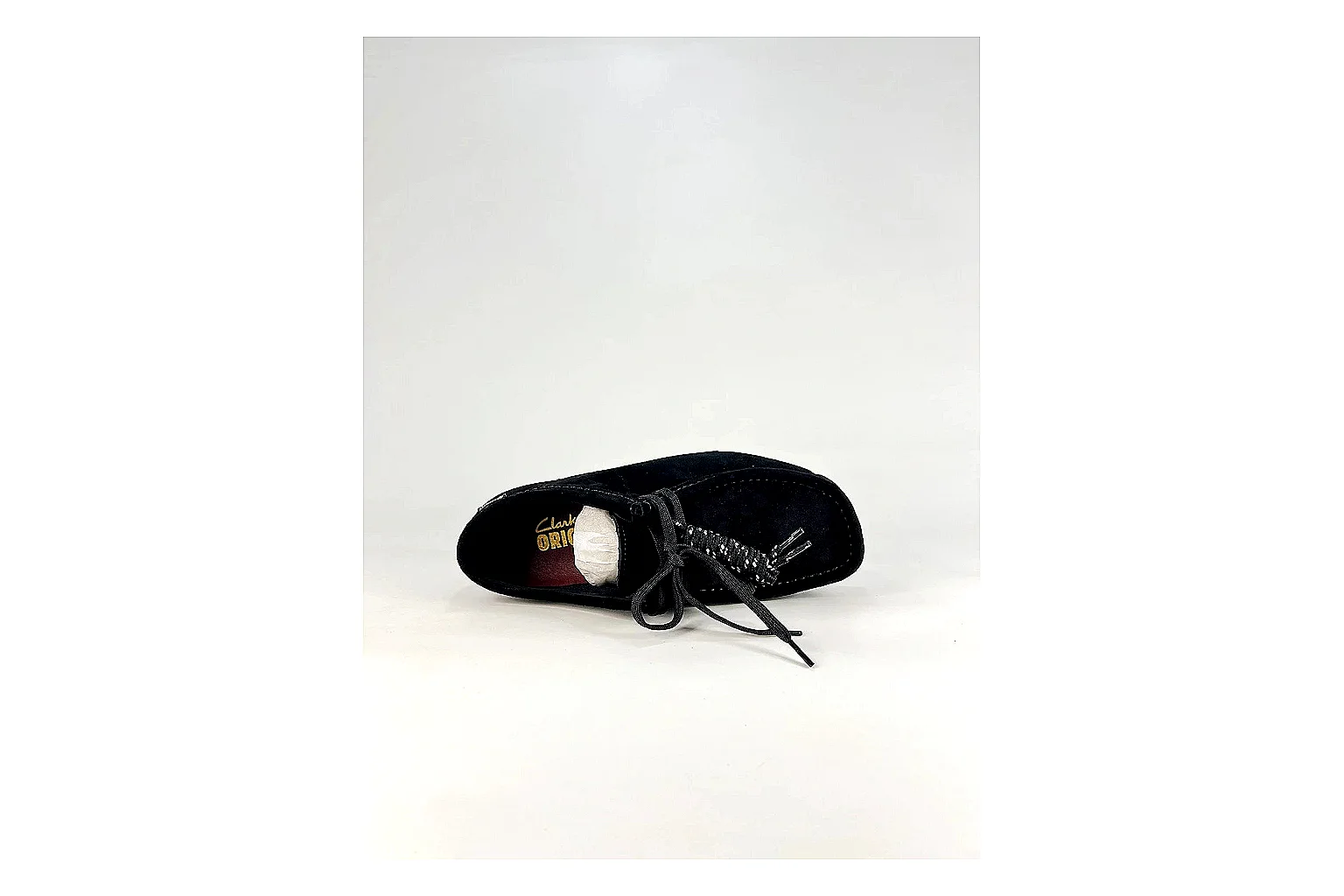 Clarks Wallabee Black Sneakers comparison signal photo with black suede Wallabee shoes with suede texture, side-profile shape, upper panel lines, and outsole detail thumbnail 2