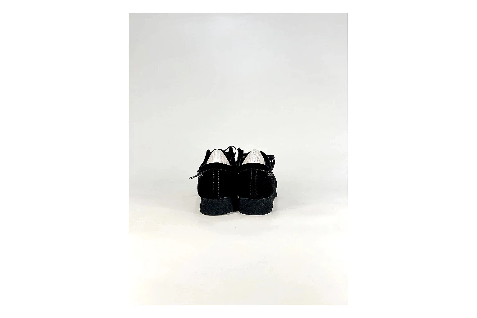 Clarks Wallabee Black Sneakers comparison signal photo with black suede Wallabee shoes with suede texture, side-profile shape, upper panel lines, and outsole detail thumbnail 3