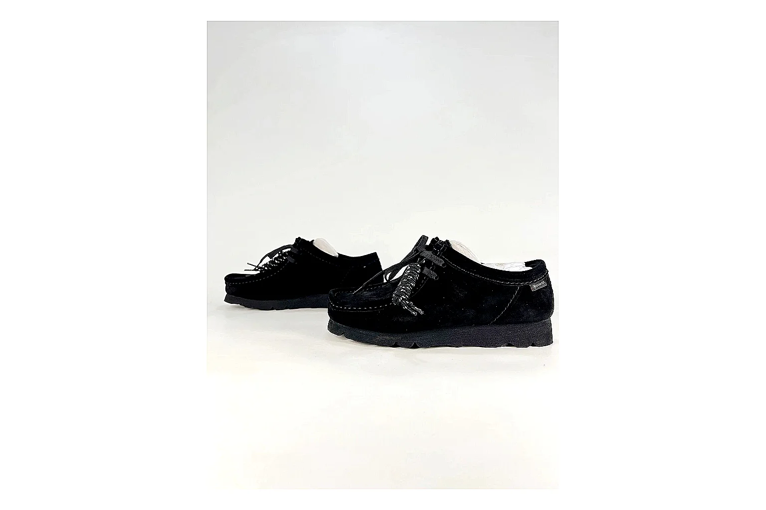 Clarks Wallabee Black Sneakers comparison signal photo with black suede Wallabee shoes with suede texture, side-profile shape, upper panel lines, and outsole detail thumbnail 5