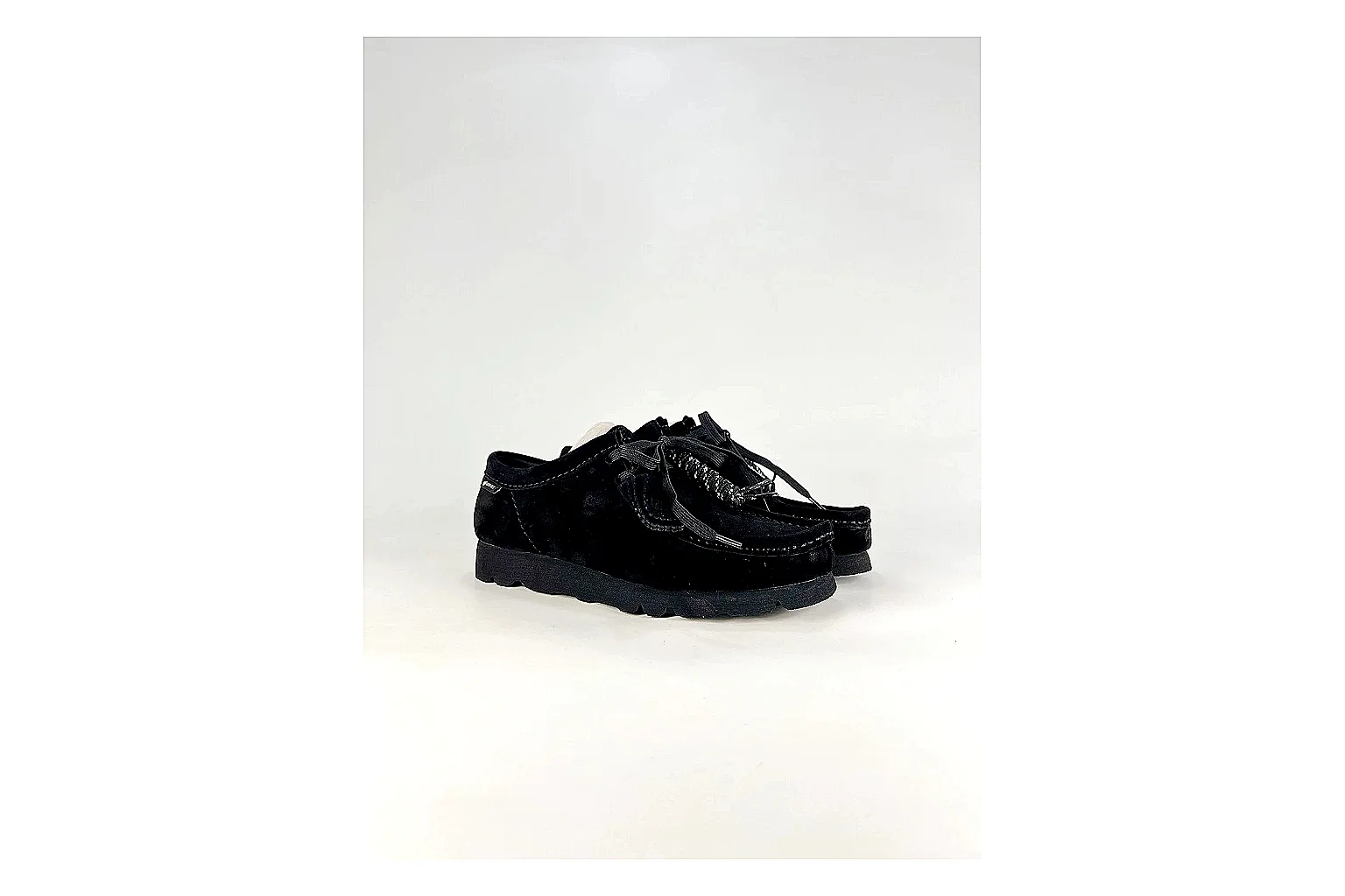 Clarks Wallabee Black Sneakers comparison signal photo with black suede Wallabee shoes with suede texture, side-profile shape, upper panel lines, and outsole detail thumbnail 6