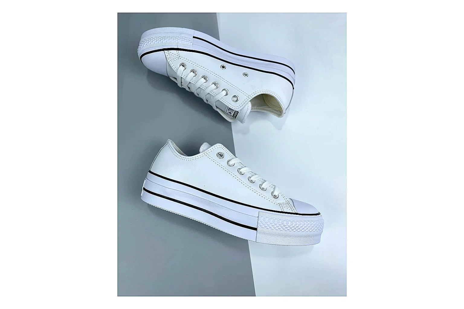 Converse All Star Lift White Platform Low Top comparison photo showing white smooth low-top upper, silver eyelets, black foxing stripes, and elevated platform rubber sole