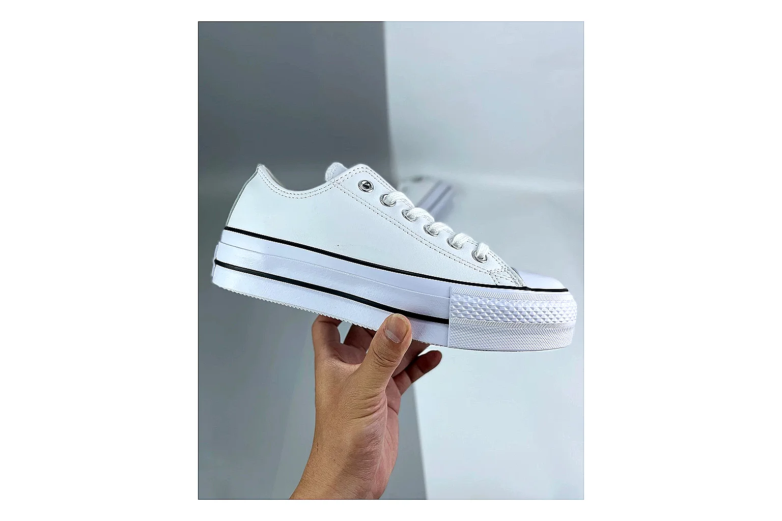 Converse All Star Lift White Platform Low Top comparison photo showing white smooth low-top upper, silver eyelets, black foxing stripes, and elevated platform rubber sole thumbnail 6