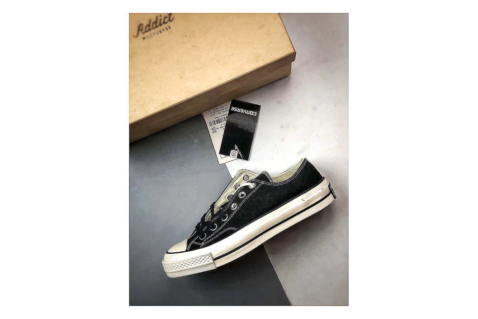 Converse Chuck Low Black White comparison photo showing black canvas low-top upper, white rubber toe cap, metal eyelets, and classic Converse sole thumbnail 2