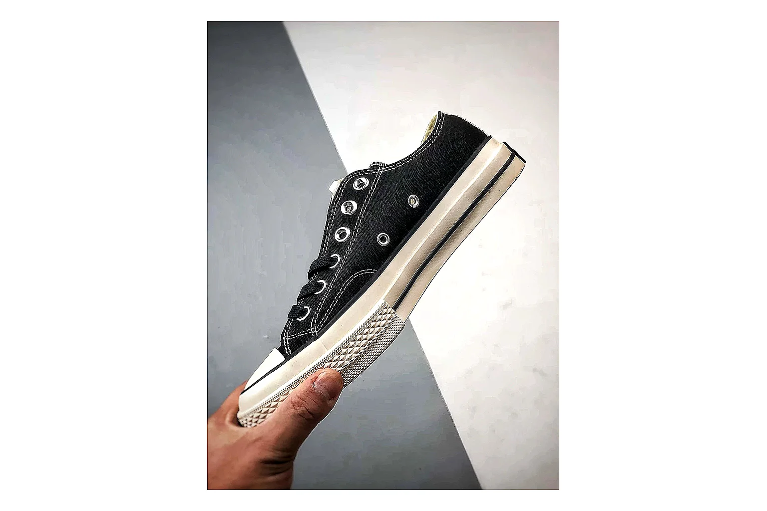 Converse Chuck Low Black White comparison photo showing black canvas low-top upper, white rubber toe cap, metal eyelets, and classic Converse sole thumbnail 3