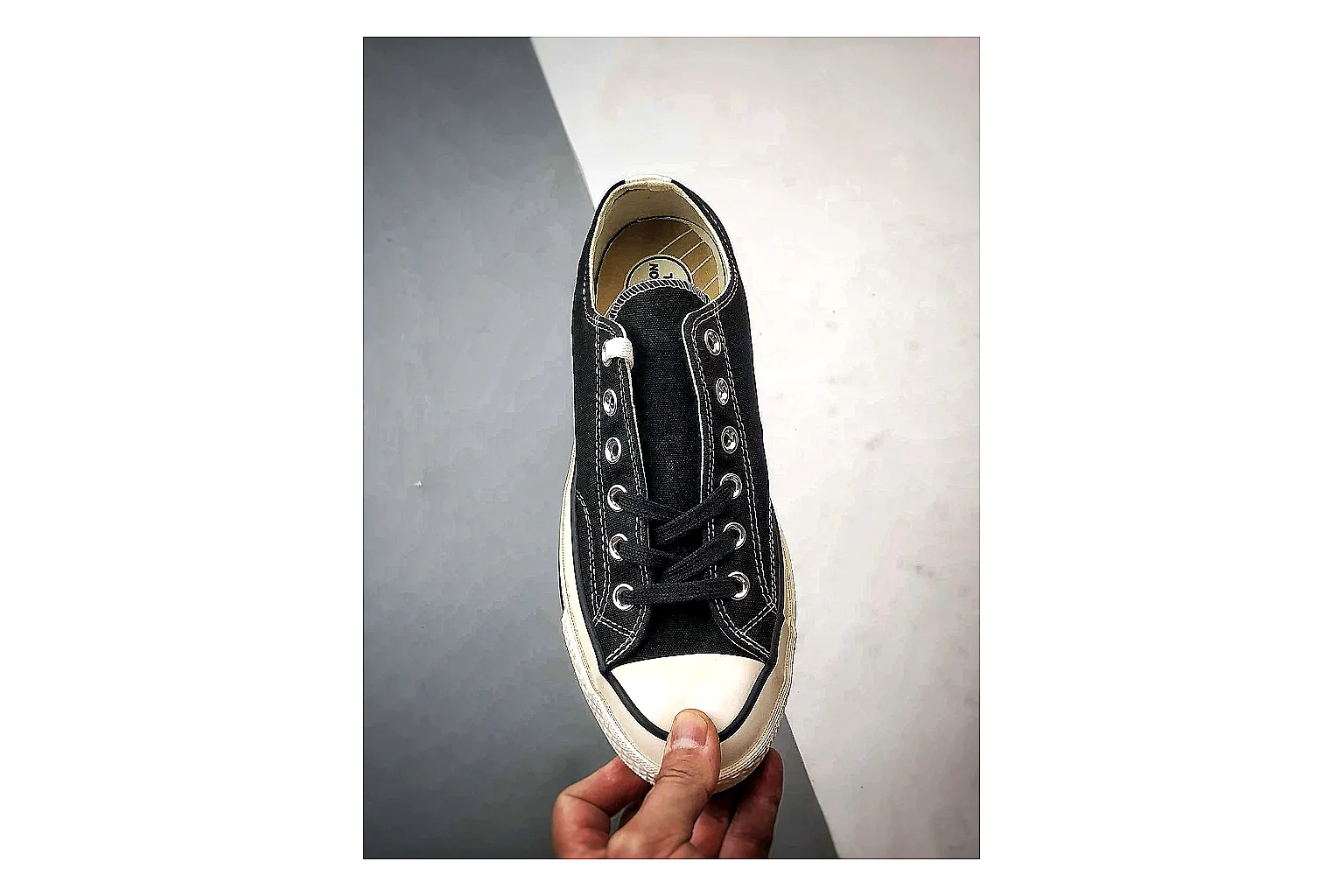 Converse Chuck Low Black White comparison photo showing black canvas low-top upper, white rubber toe cap, metal eyelets, and classic Converse sole thumbnail 6