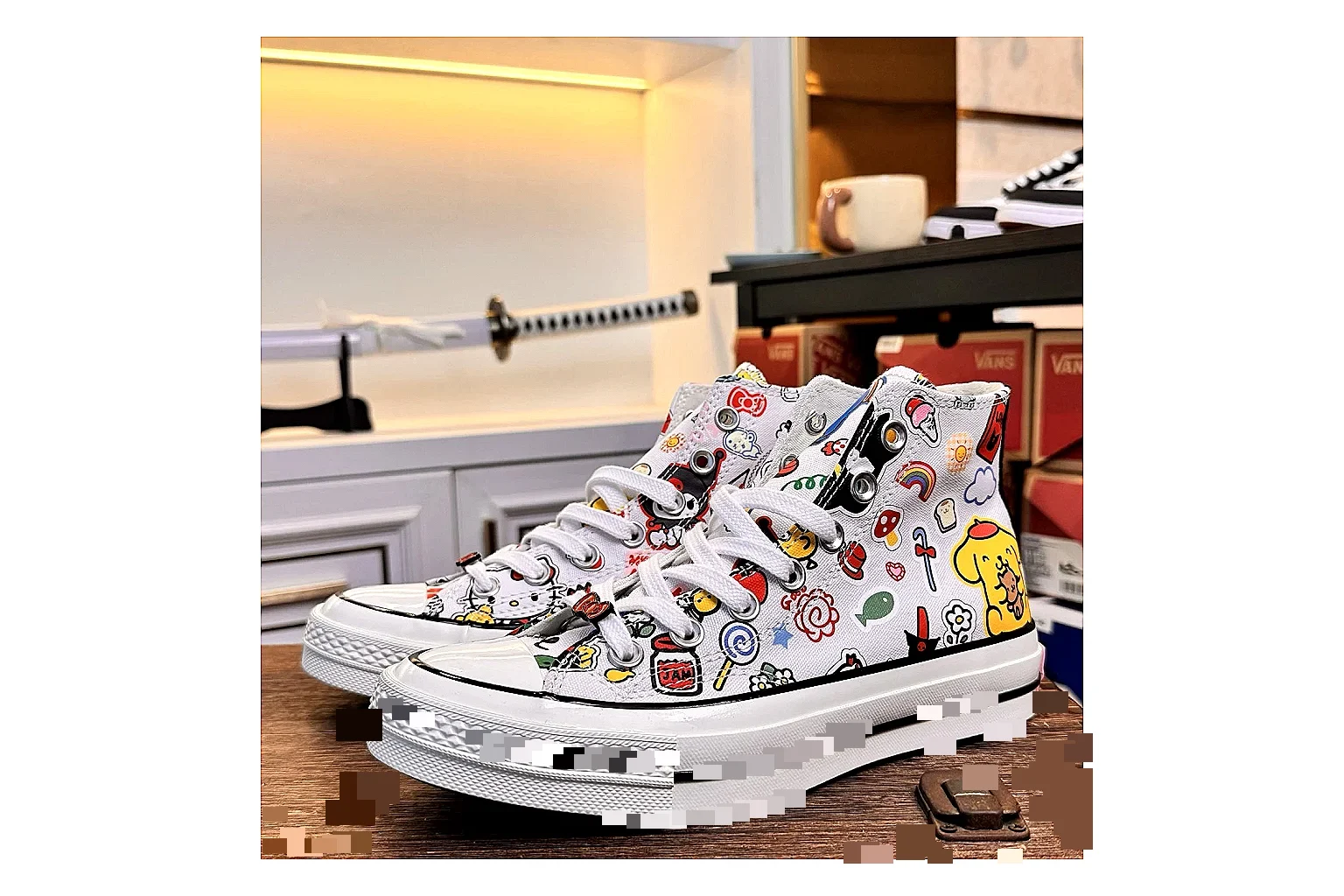 Converse Hello Kitty Chuck 70 High Top comparison photo showing white canvas high-top upper, colorful character graphics, metal eyelets, rubber toe cap, and elevated vintage sole