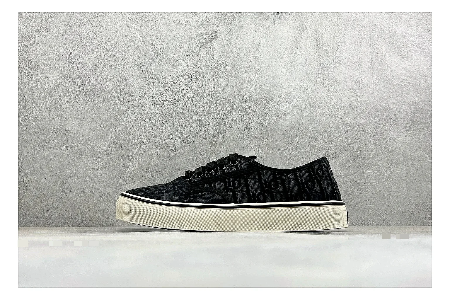 Dior Act Slide Black Low-Top comparison photo showing black monogram-style upper, low slip-on shape, chunky dark sole, and luxury casual profile
