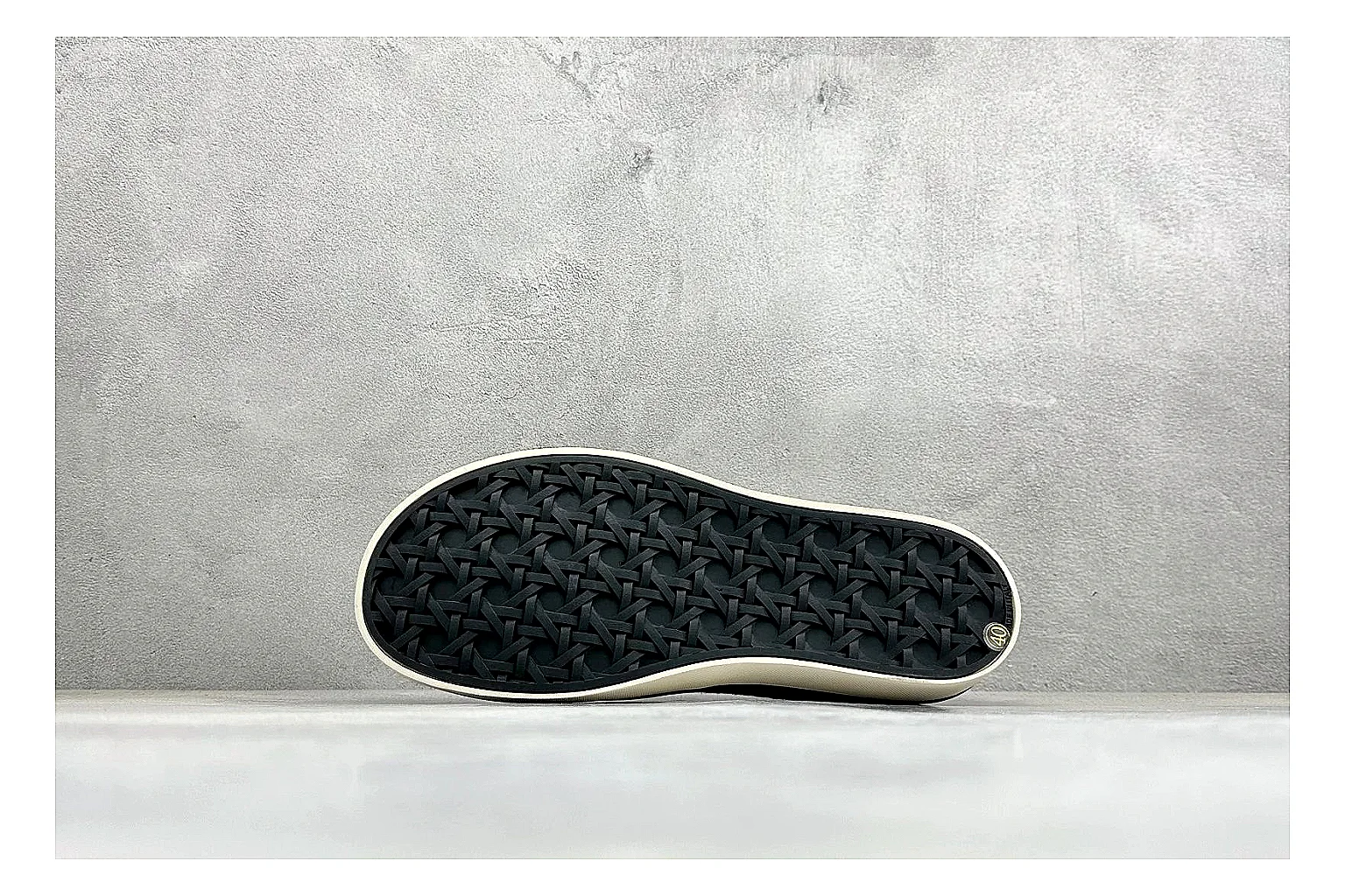 Dior Act Slide Black Low-Top comparison photo showing black monogram-style upper, low slip-on shape, chunky dark sole, and luxury casual profile thumbnail 4