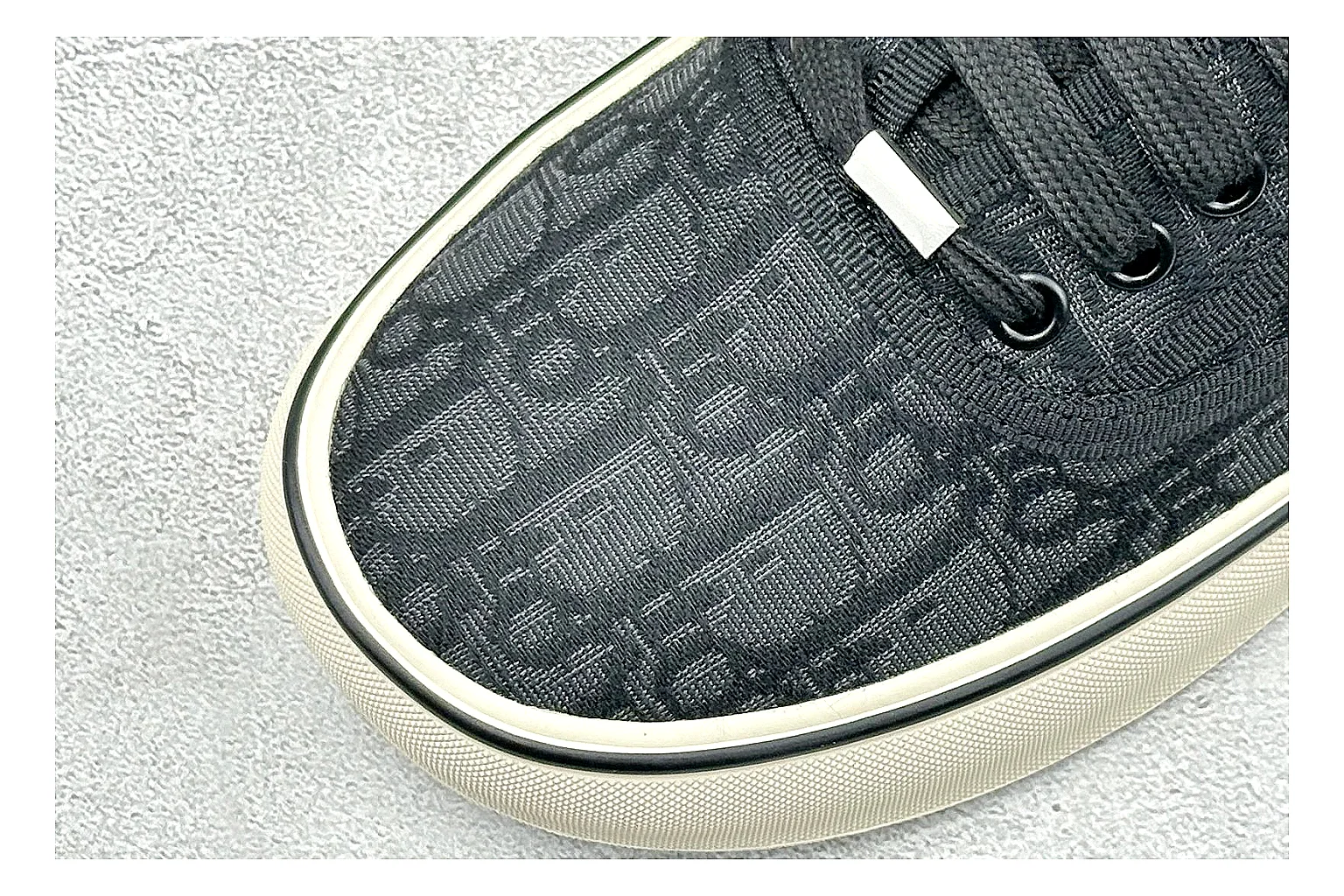 Dior Act Slide Black Low-Top comparison photo showing black monogram-style upper, low slip-on shape, chunky dark sole, and luxury casual profile thumbnail 5