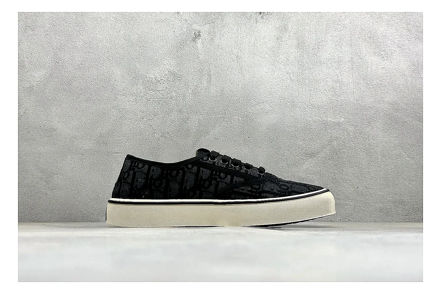Dior Act Slide Black Low-Top comparison photo showing black monogram-style upper, low slip-on shape, chunky dark sole, and luxury casual profile thumbnail 6