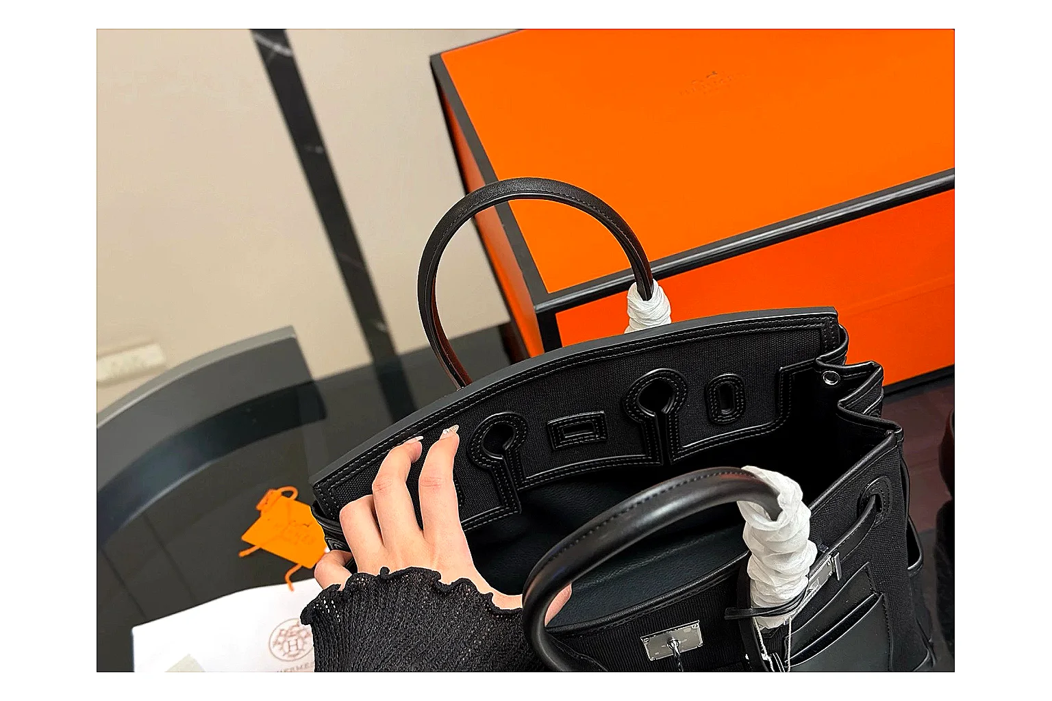 Hermes Birkin Style Black comparison photo showing black leather structured body, top handles, flap-and-strap shape, and polished hardware thumbnail 4
