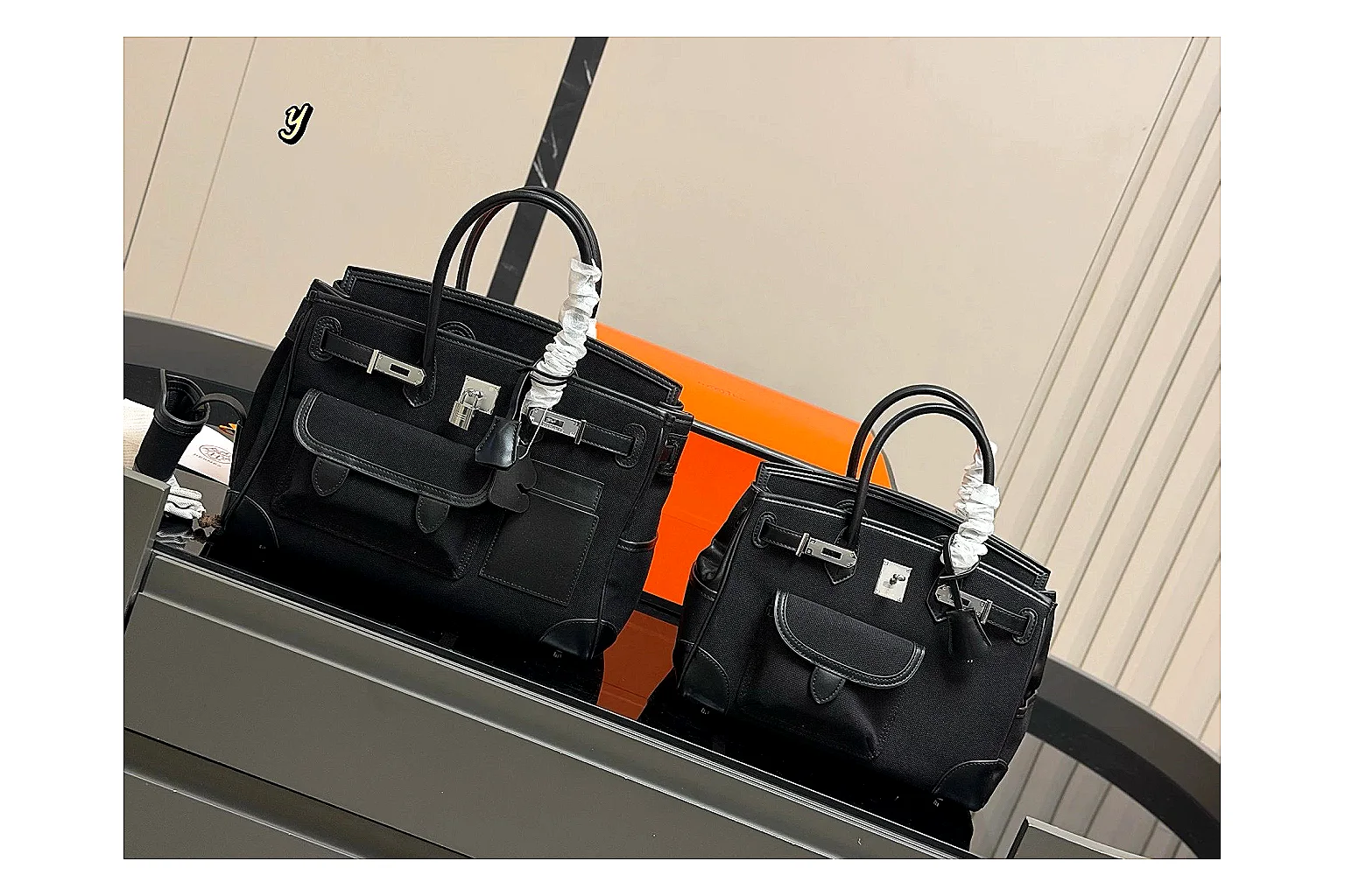 Hermes Birkin Style Black comparison photo showing black leather structured body, top handles, flap-and-strap shape, and polished hardware thumbnail 6