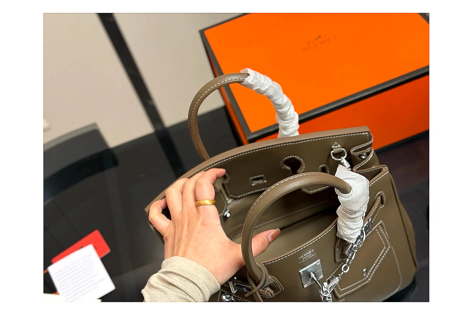 Hermes Birkin Style Olive comparison photo showing olive leather structured body, top handles, flap-and-strap shape, and polished hardware thumbnail 4