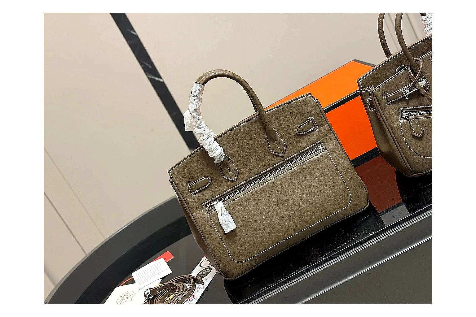 Hermes Birkin Style Olive comparison photo showing olive leather structured body, top handles, flap-and-strap shape, and polished hardware thumbnail 5