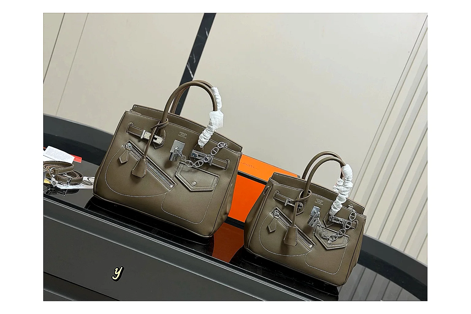 Hermes Birkin Style Olive comparison photo showing olive leather structured body, top handles, flap-and-strap shape, and polished hardware thumbnail 6