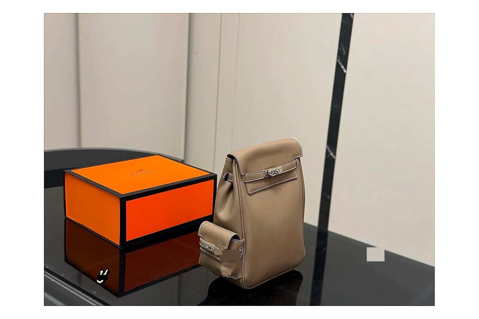 Hermes Kelly Backpack Beige comparison photo showing beige leather backpack body, Kelly-style flap, top handle, shoulder straps, and polished hardware
