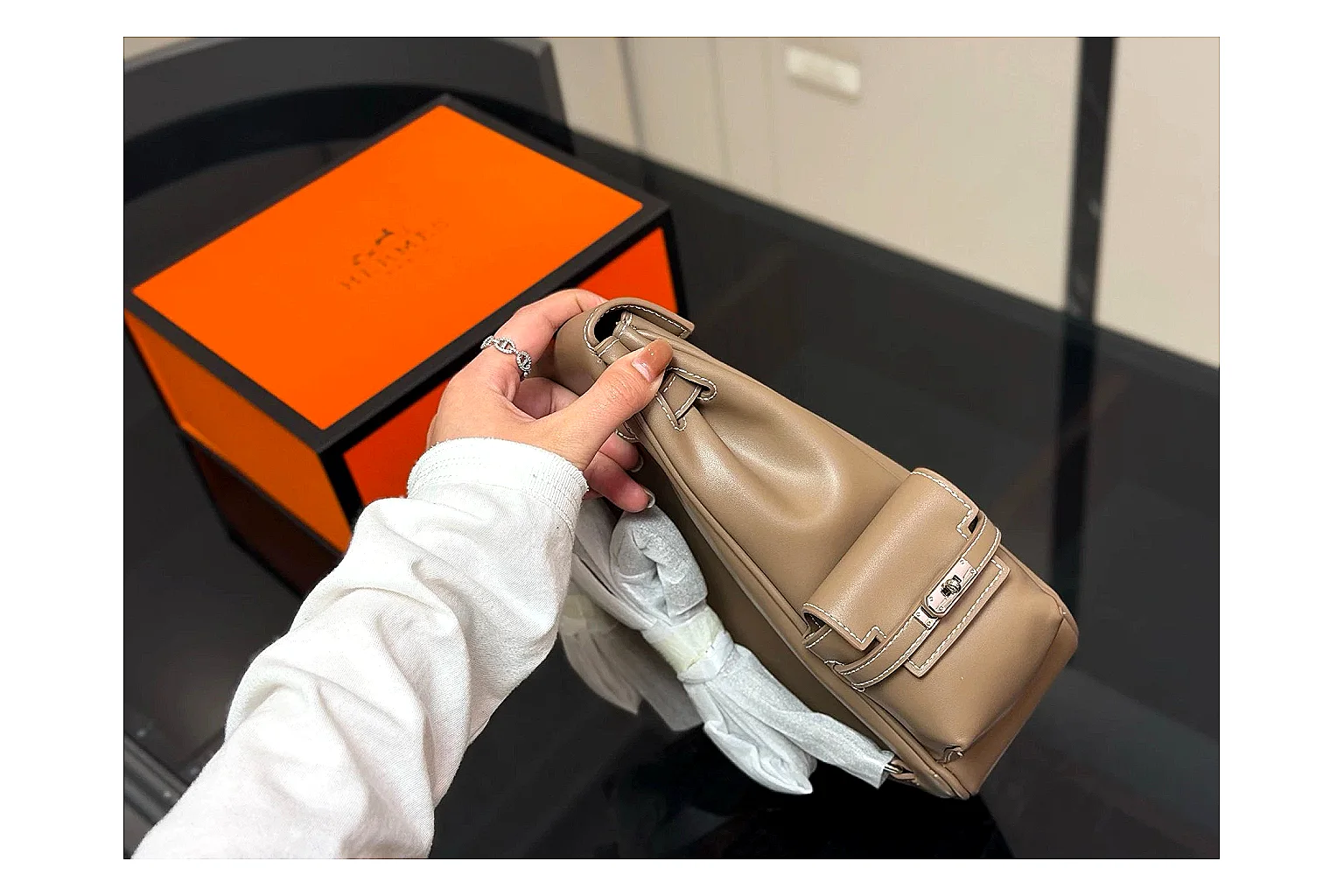 Hermes Kelly Backpack Beige comparison photo showing beige leather backpack body, Kelly-style flap, top handle, shoulder straps, and polished hardware thumbnail 5