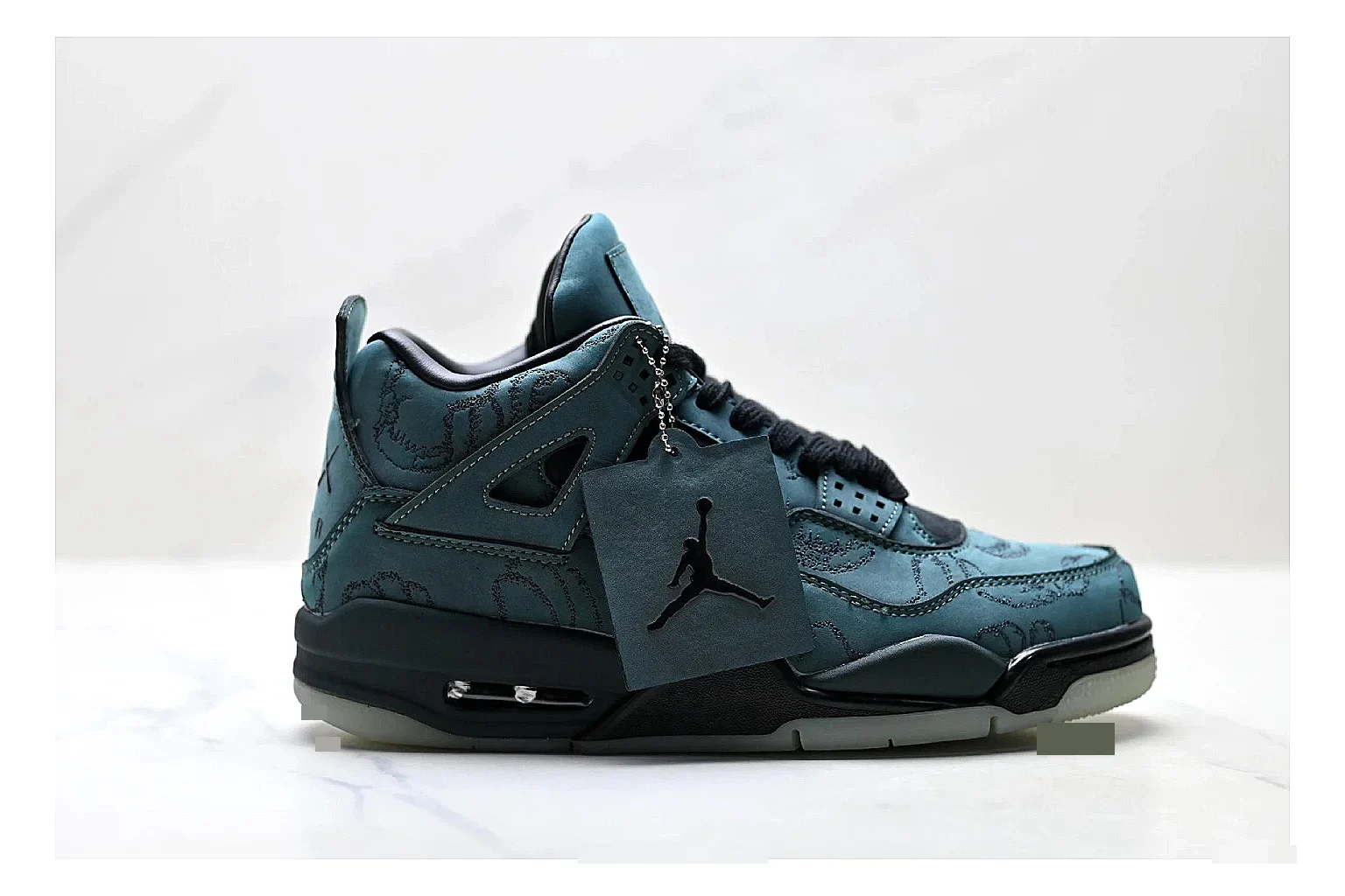 Jordan Air Jordan 4 Teal Black Sneakers comparison signal photo with teal black retro basketball sneakers with nubuck texture, side-profile shape, upper panel lines, and outsole detail
