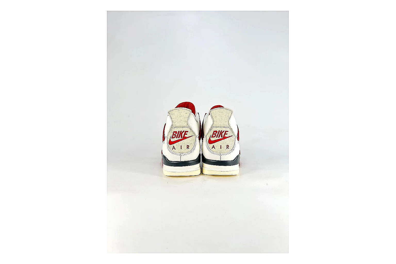 Jordan Air Jordan 4 White Red Sneakers comparison signal photo with white red retro basketball sneakers with leather texture, side-profile shape, upper panel lines, and outsole detail thumbnail 3