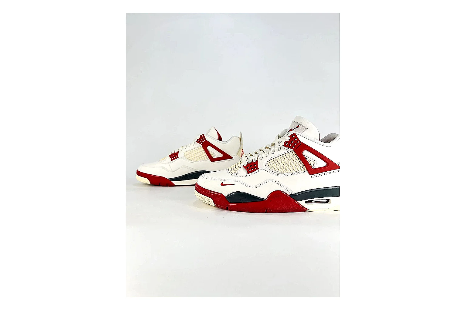 Jordan Air Jordan 4 White Red Sneakers comparison signal photo with white red retro basketball sneakers with leather texture, side-profile shape, upper panel lines, and outsole detail thumbnail 5