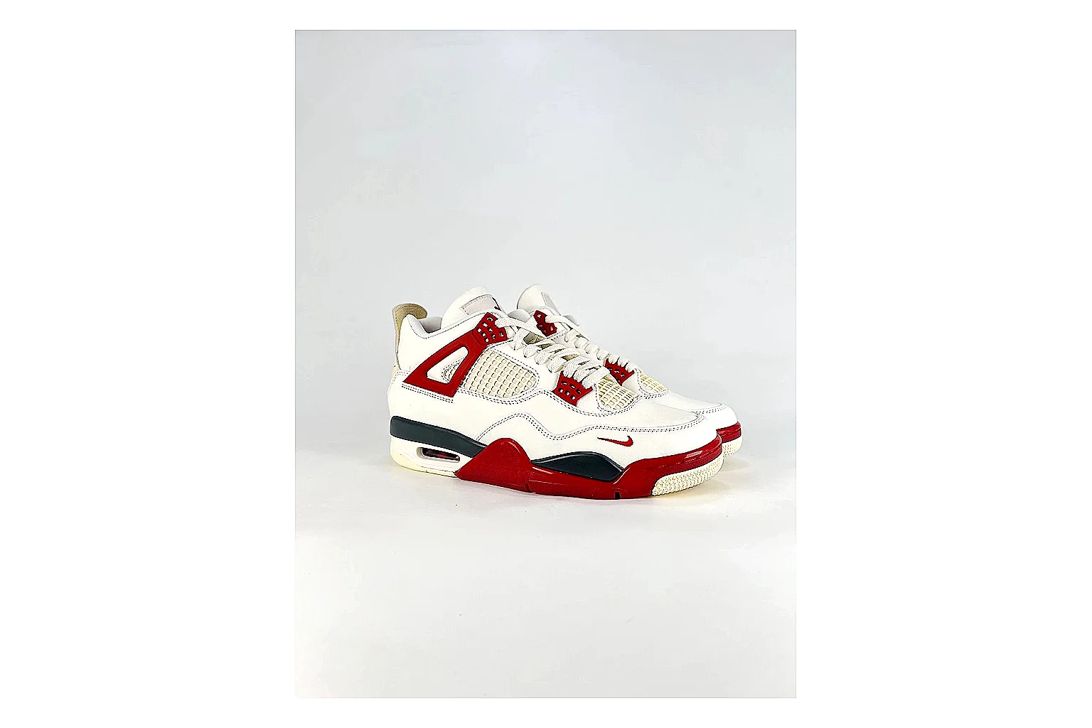 Jordan Air Jordan 4 White Red Sneakers comparison signal photo with white red retro basketball sneakers with leather texture, side-profile shape, upper panel lines, and outsole detail thumbnail 6