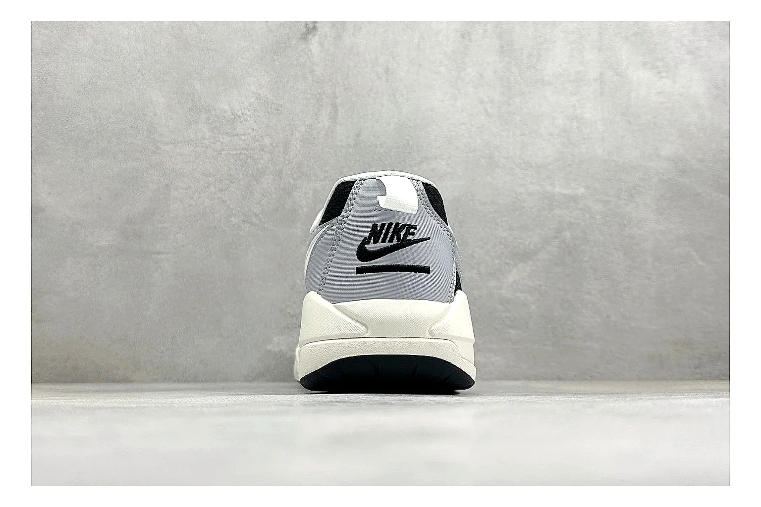 Jordan CMFT Black White comparison photo showing black and white layered panels, low padded collar, visible Jordan styling cues, and a compact court sole thumbnail 3