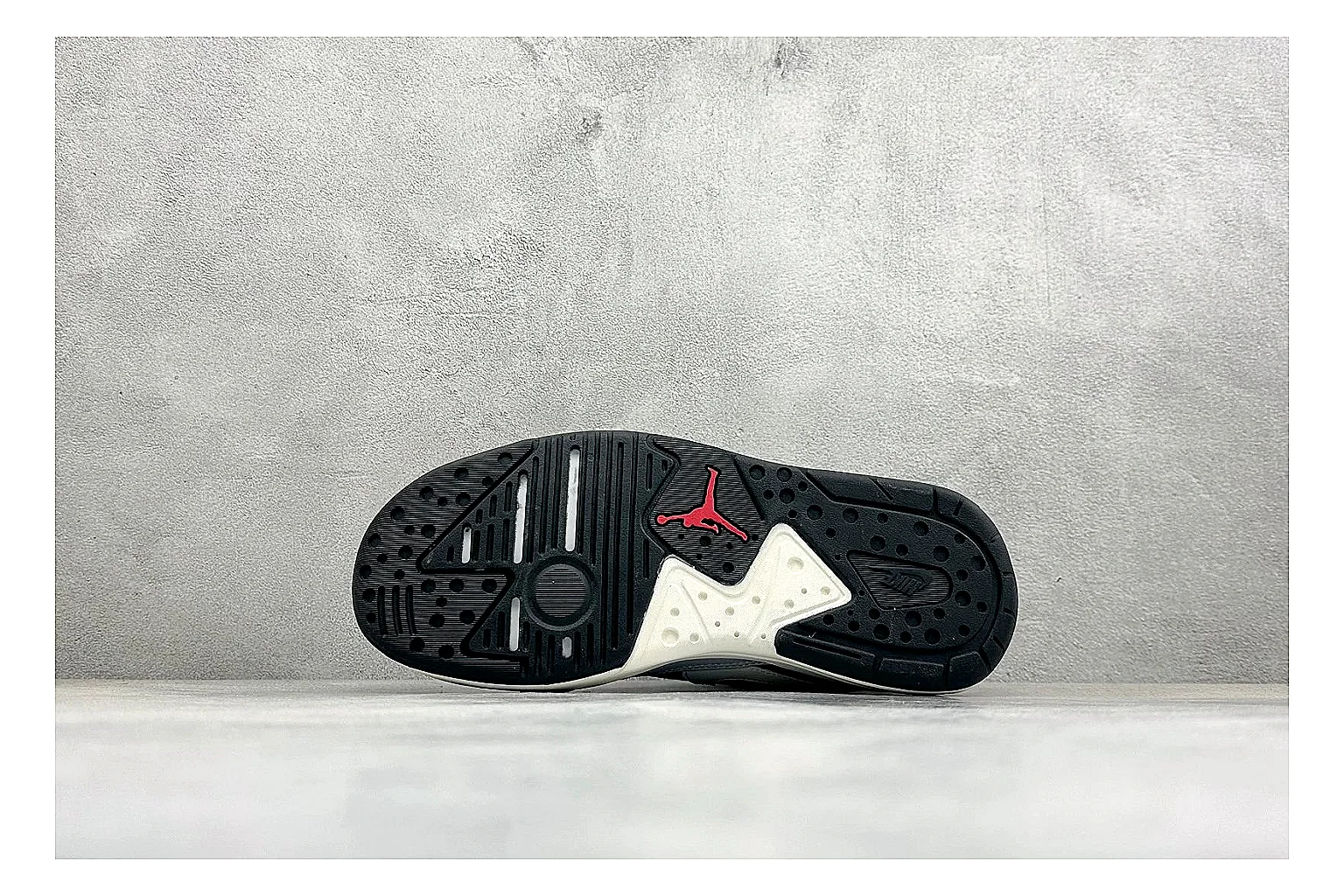 Jordan CMFT Black White comparison photo showing black and white layered panels, low padded collar, visible Jordan styling cues, and a compact court sole thumbnail 4