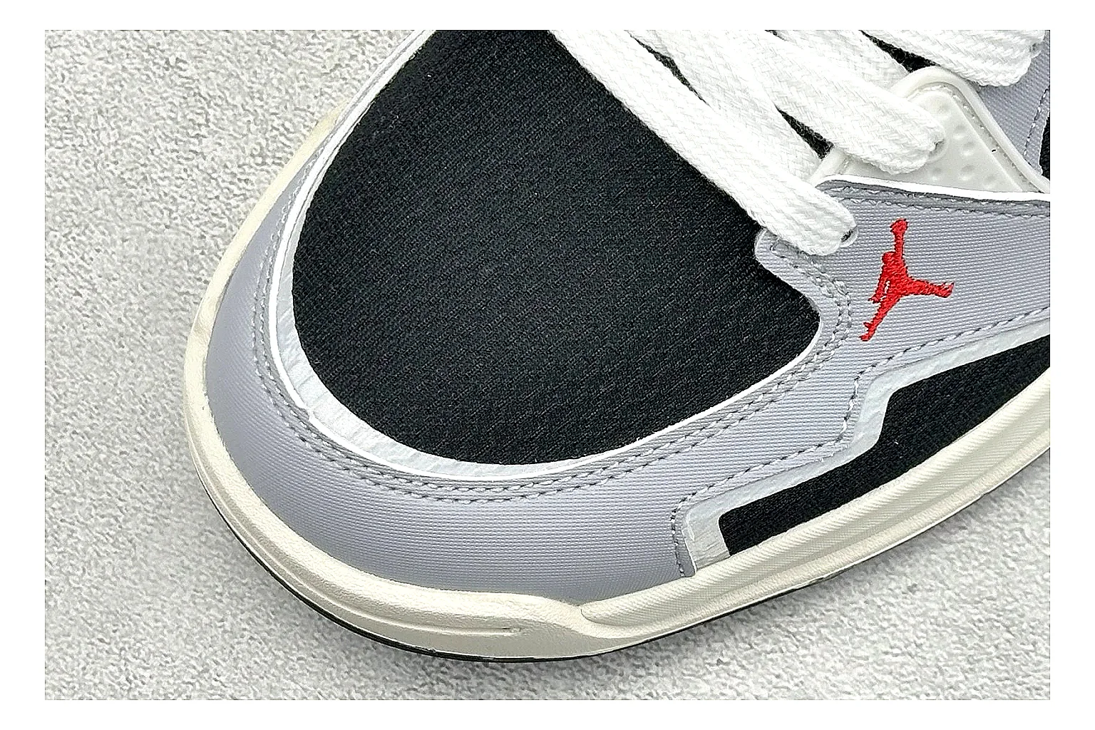 Jordan CMFT Black White comparison photo showing black and white layered panels, low padded collar, visible Jordan styling cues, and a compact court sole thumbnail 5