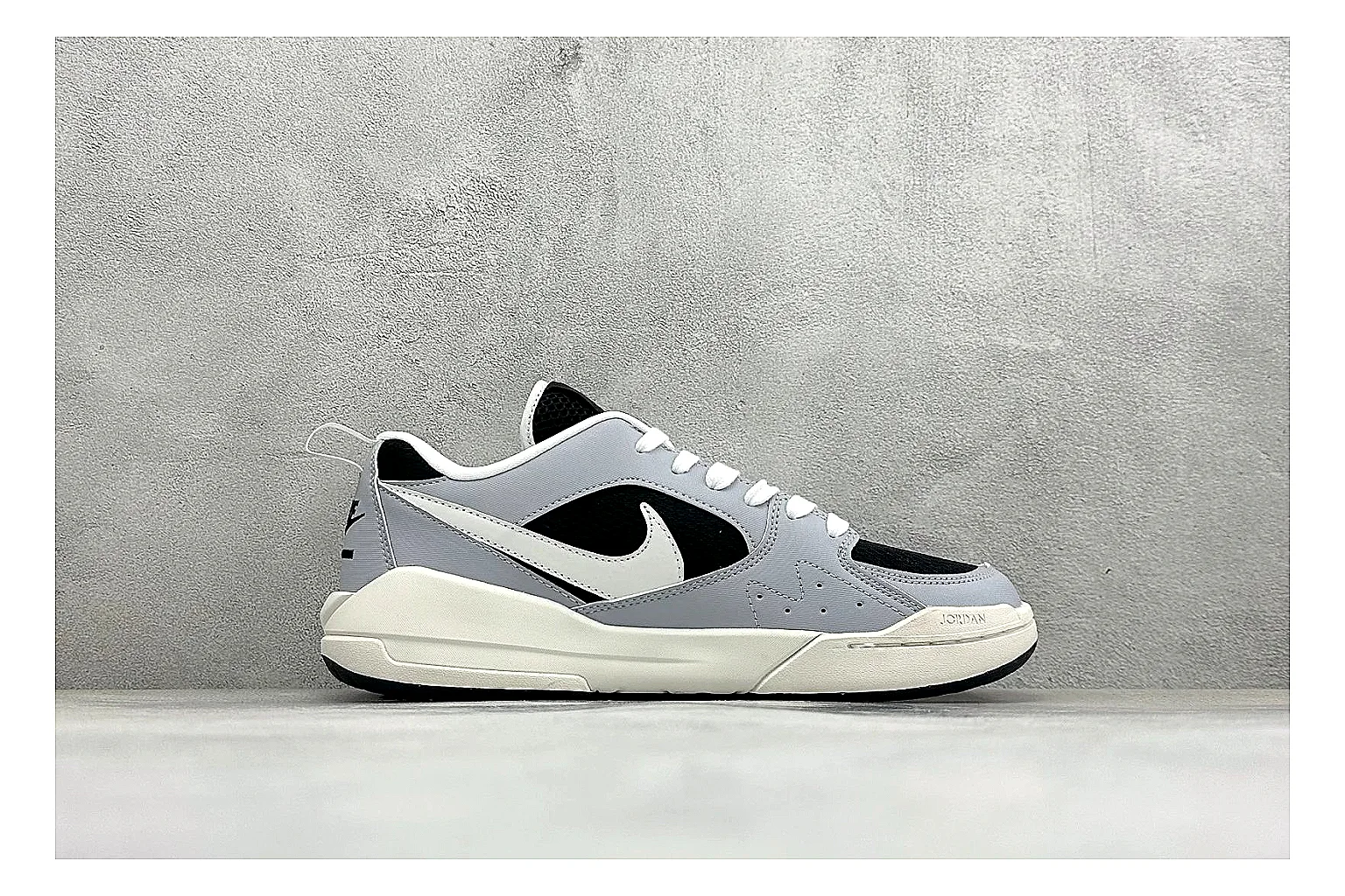 Jordan CMFT Black White comparison photo showing black and white layered panels, low padded collar, visible Jordan styling cues, and a compact court sole thumbnail 6