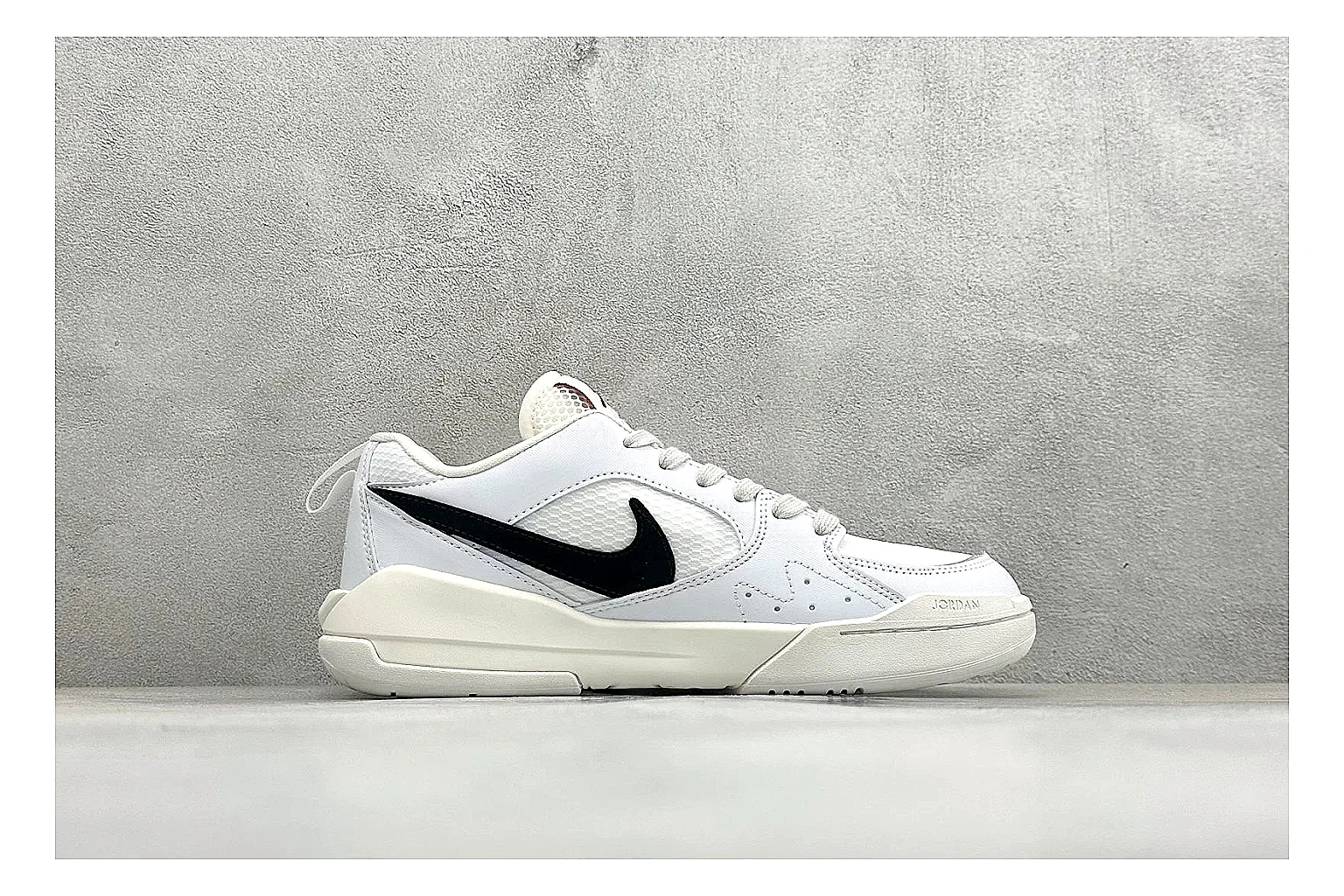 Jordan CMFT White Black comparison photo showing white and black layered court panels, red logo detail, low collar, and a clean contrast sole thumbnail 6