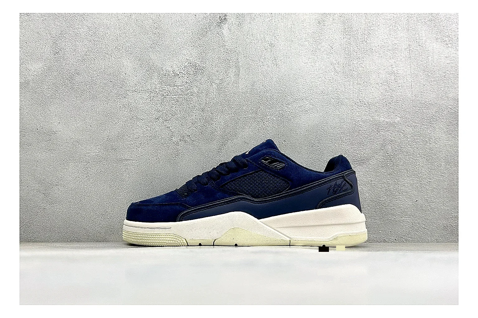 Jordan Flight Navy Suede comparison photo showing navy suede upper, low court silhouette, cream sole, and soft retro basketball profile