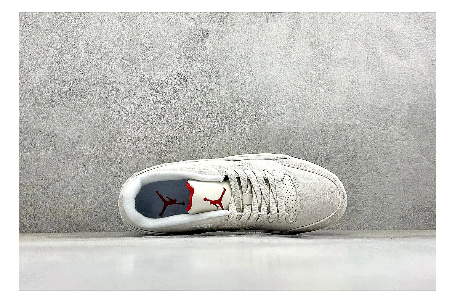Jordan Flight White comparison photo showing white low court upper, cream sole, simple Jordan styling, and soft retro basketball profile thumbnail 2