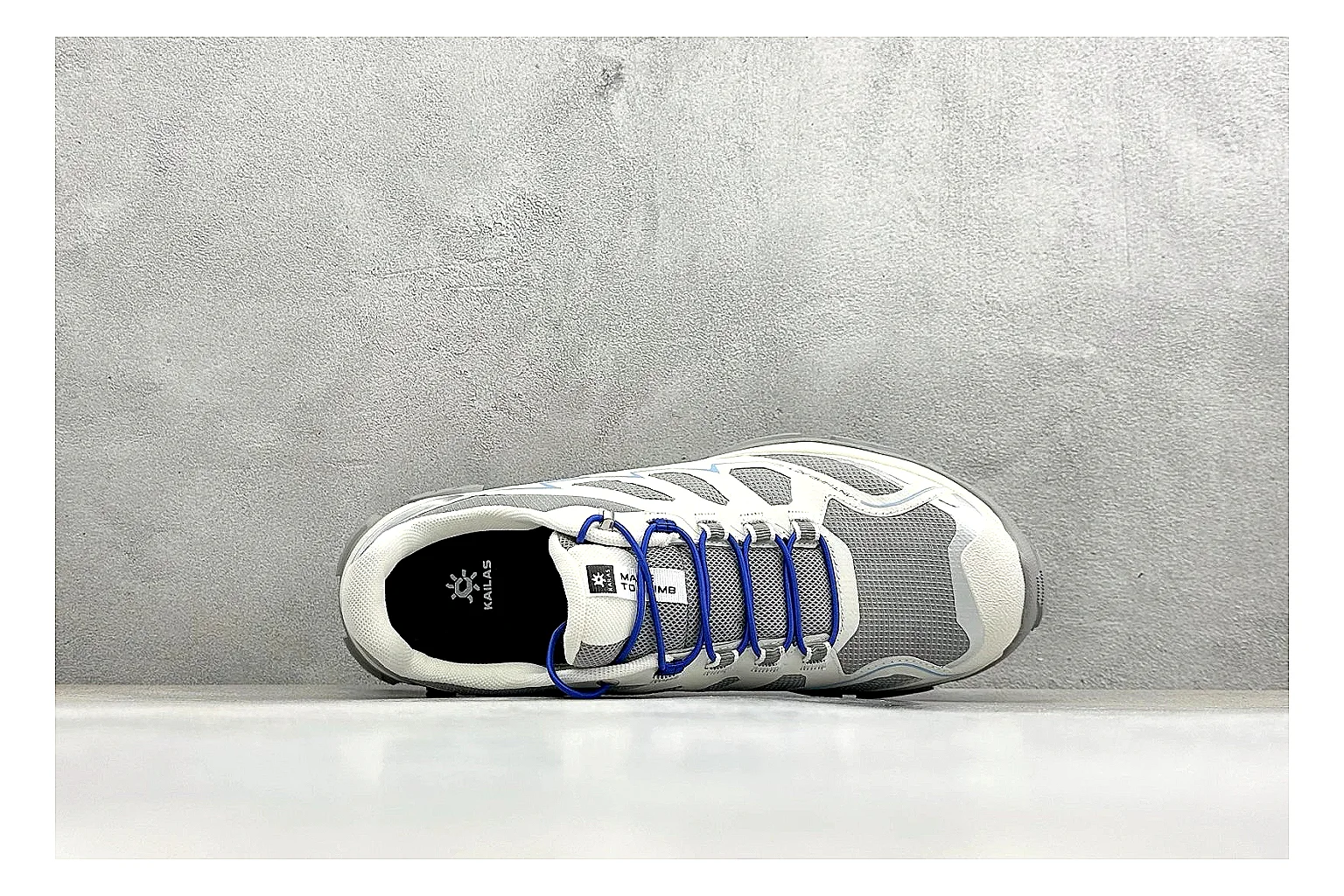 Kailas Fuga 5 White Blue comparison photo showing white trail upper, blue accents, Vibram outsole, and protective technical running build