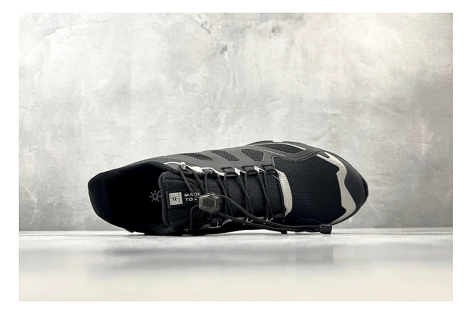 Kailas Fuga Black Vibram comparison photo showing black trail upper, Vibram outsole, reinforced overlays, and rugged outdoor running shape