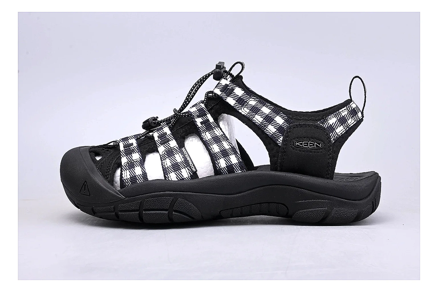 KEEN Zerraport Plaid Sandal comparison signal photo with white black plaid zerraport outdoor sandal with mixed upper and sandal shape