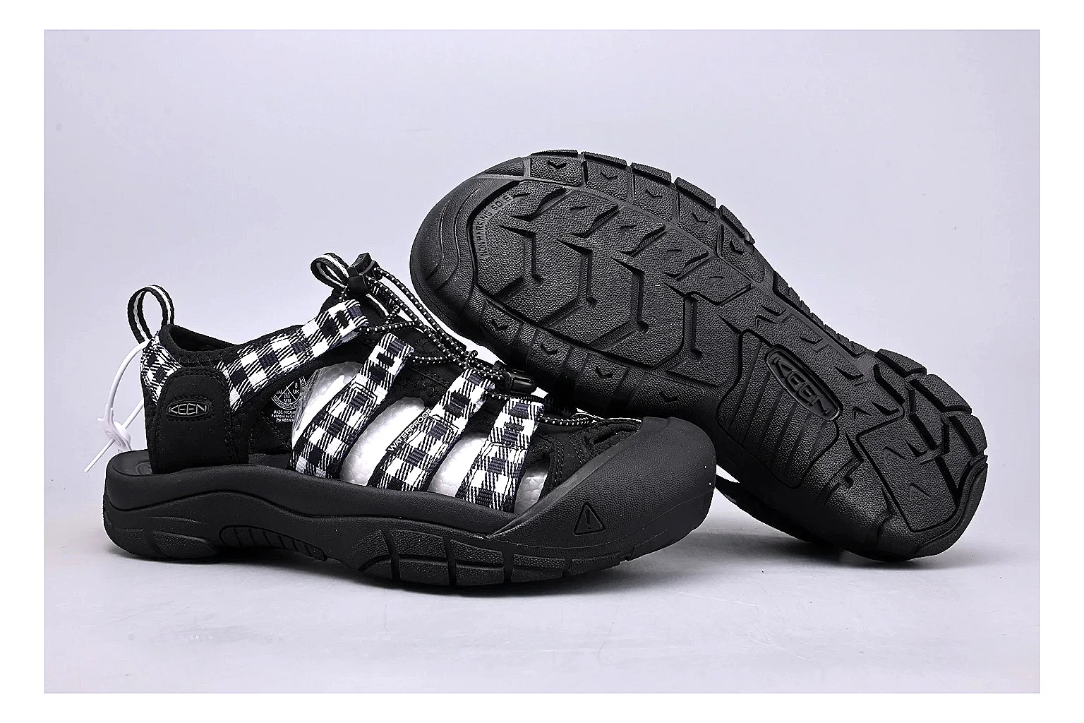 KEEN Zerraport Plaid Sandal comparison signal photo with white black plaid zerraport outdoor sandal with mixed upper and sandal shape thumbnail 5