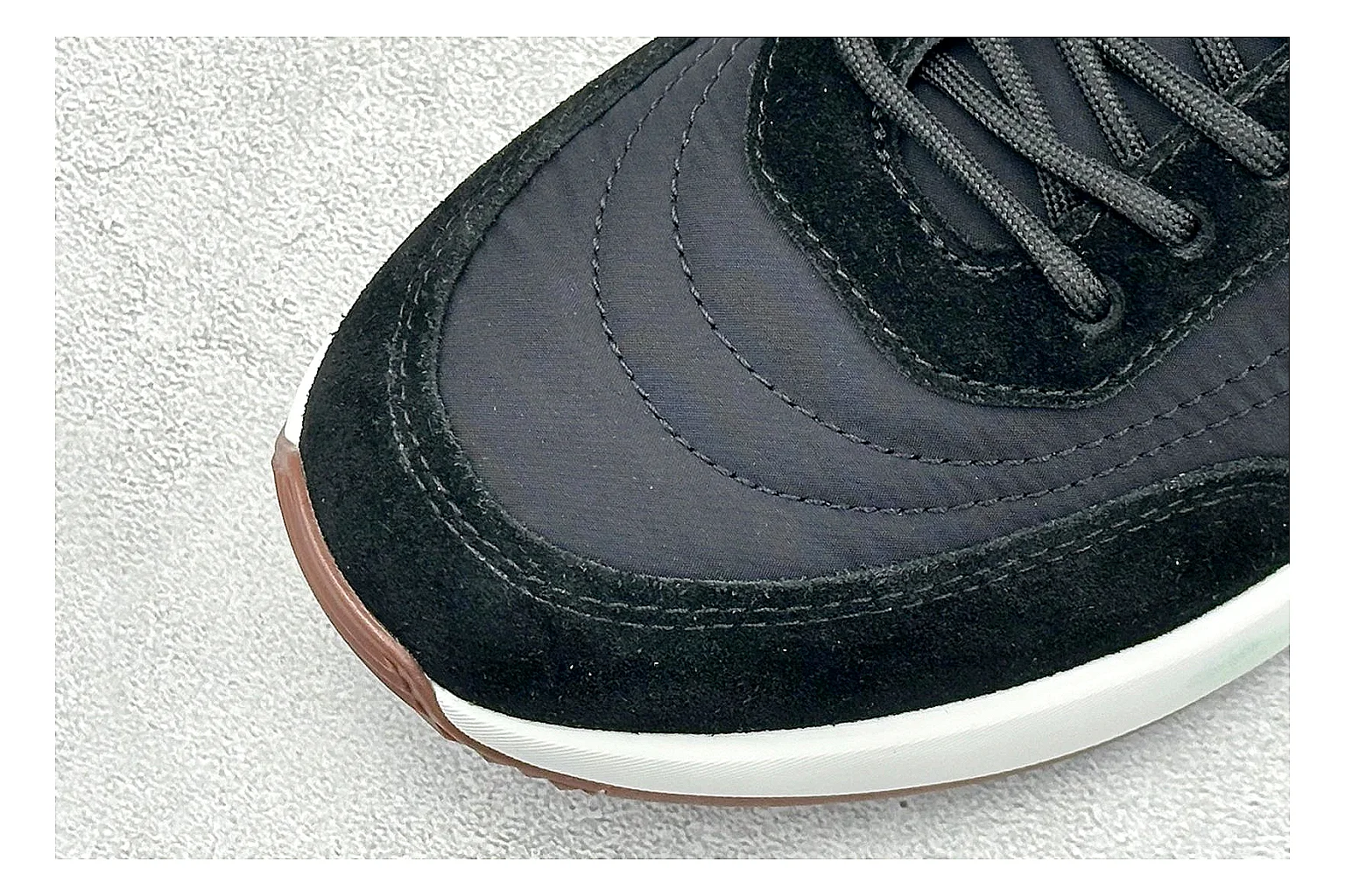 Loro Piana Week-End Black comparison image with black suede upper, low casual profile, striped midsole accent, and soft everyday shape thumbnail 5